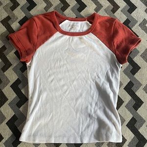 Orange and white, short sleeve shirt.